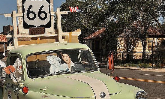 Elvis and Marilyn in the old green truck at Angel and Vilma's Gift Shop on Route 66 in Seligman, Arizona