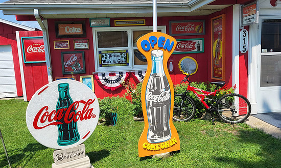 Coca-Cola signs in the front of the Perkins Wood and Glass ... "The Shop" ... on Route 66 in Gardner, Illinois