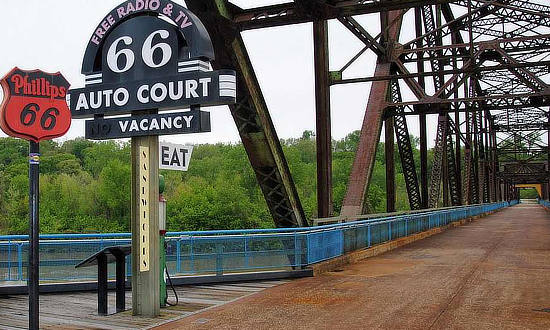 Old Route 66 signs at a resting stop on the old Chain of Rocks Bridge between Illinois and Missouri