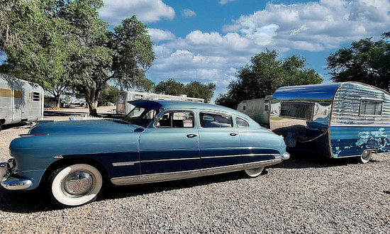 Vintage Hudson and travel trailer on display at the Enchanted Trails RV Park & Trading Post on Route 66 in Albuquerque, New Mexico