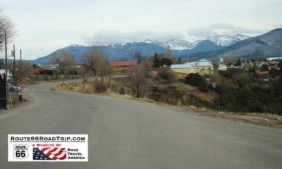 Scene along the Turquoise Trail with snow-capped mountains in the distance